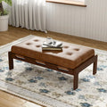 Table basse de forme rectangulaire de 48,4 pouces, capitonnée et tapissée, avec un cadre en bois d'hévéa, pouvant servir de repose-pieds en cuir.